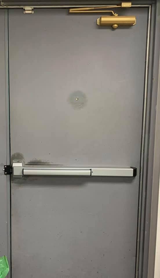 commercial door with a new crash bar installed