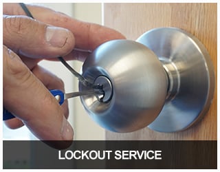Lockout Service - image of a locksmith picking a commercial doorknob